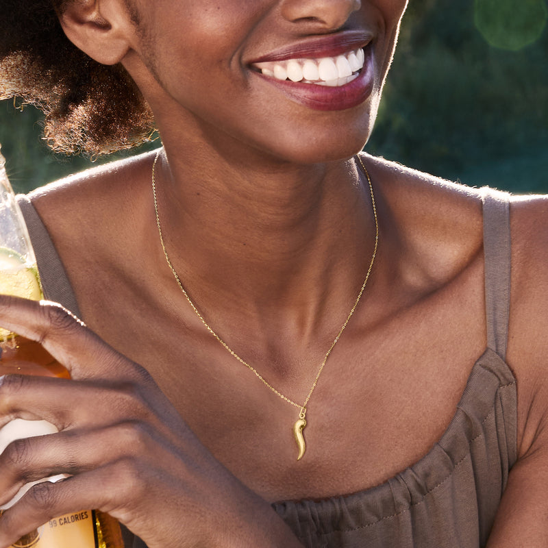10k yellow gold horn charm pendant on a thin chain
