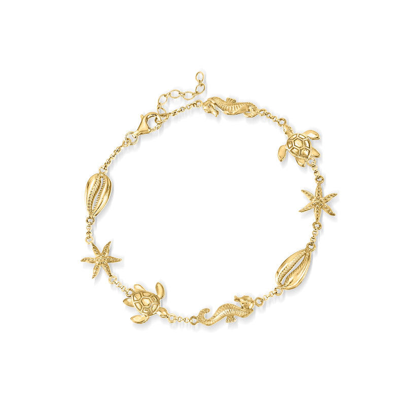Gold over sterling sea life anklet with starfish, turtle, and shell charms
