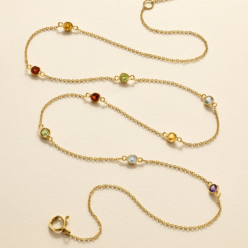 Multi-stone station necklace, yellow gold chain with colorful round gems and clasp