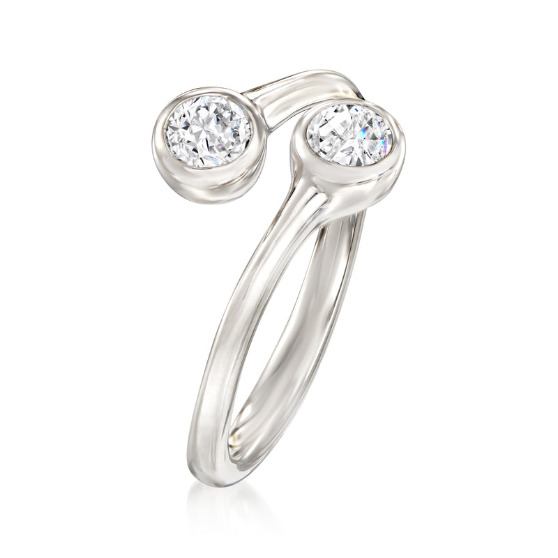 Platinum bypass diamond ring, two round stones in bezel settings