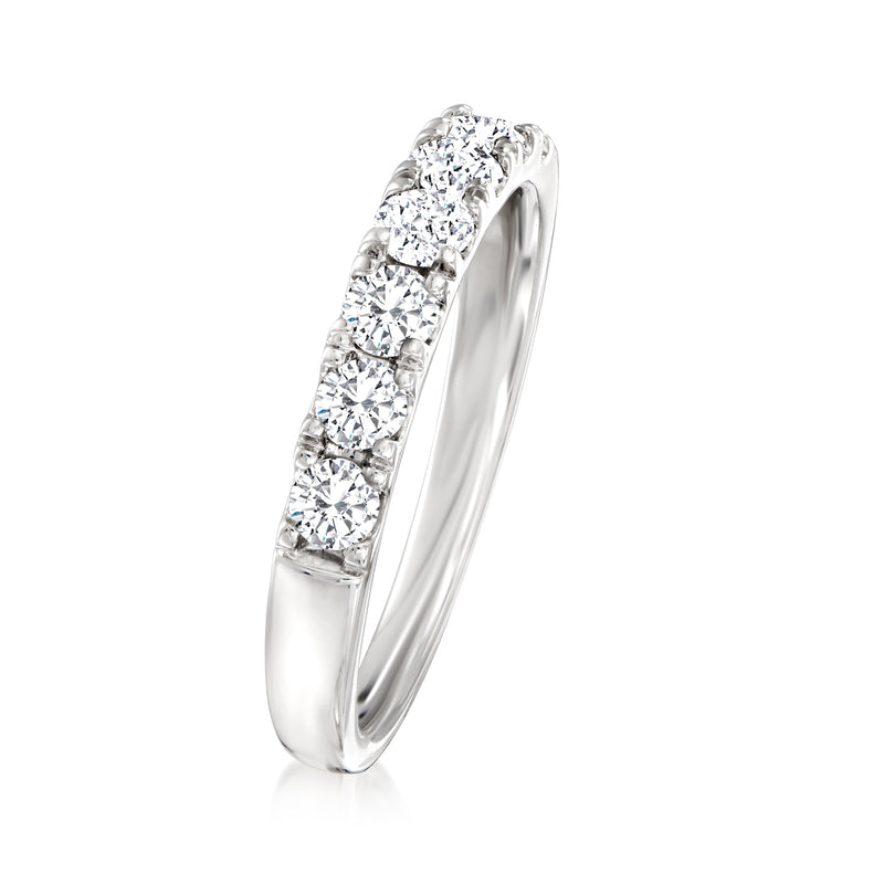 Platinum diamond band ring, side view with raised multi-stone round diamonds