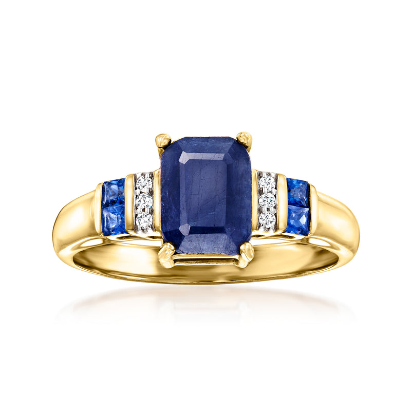 Yellow gold ring with cushion sapphire, baguette diamonds, and blue side stones