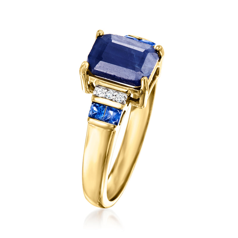Yellow gold ring with square sapphire center, baguette diamonds, and blue accents