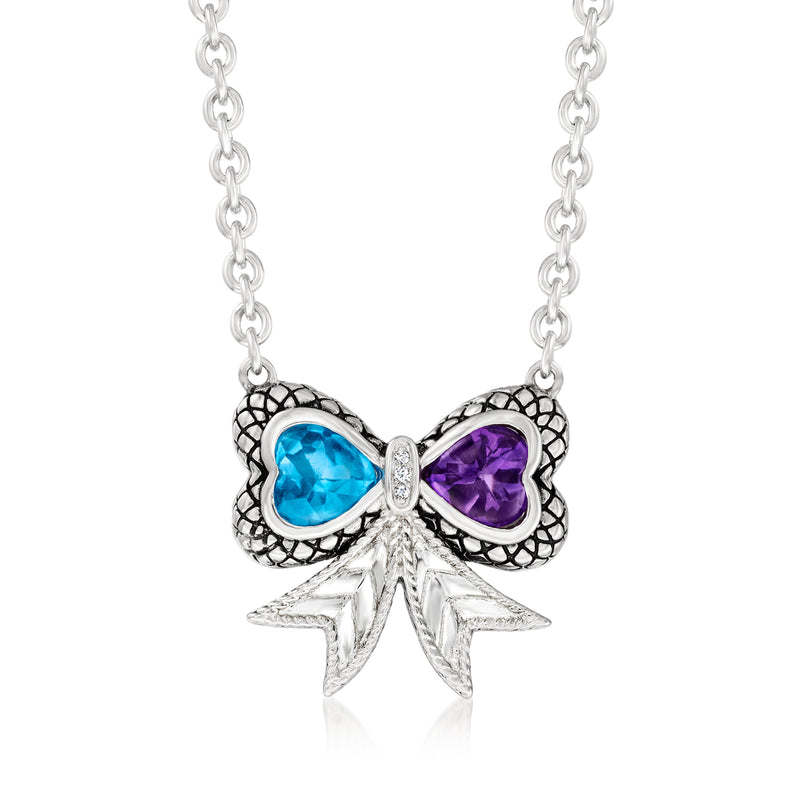 Sterling silver ribbon necklace with blue and purple gemstone bow pendant and diamond accents