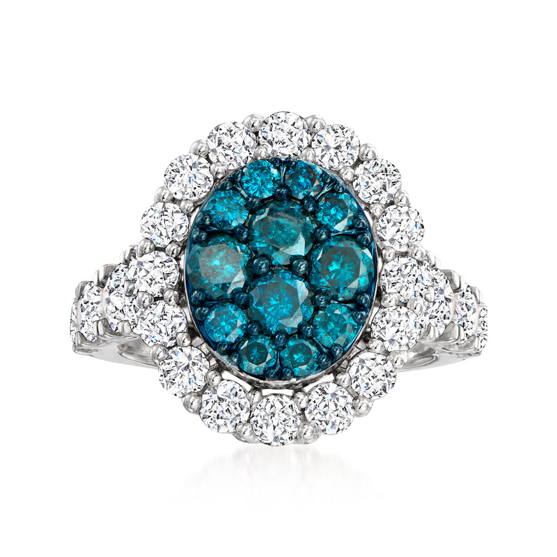 Blue and white diamond ring in 14kt white gold with oval halo setting