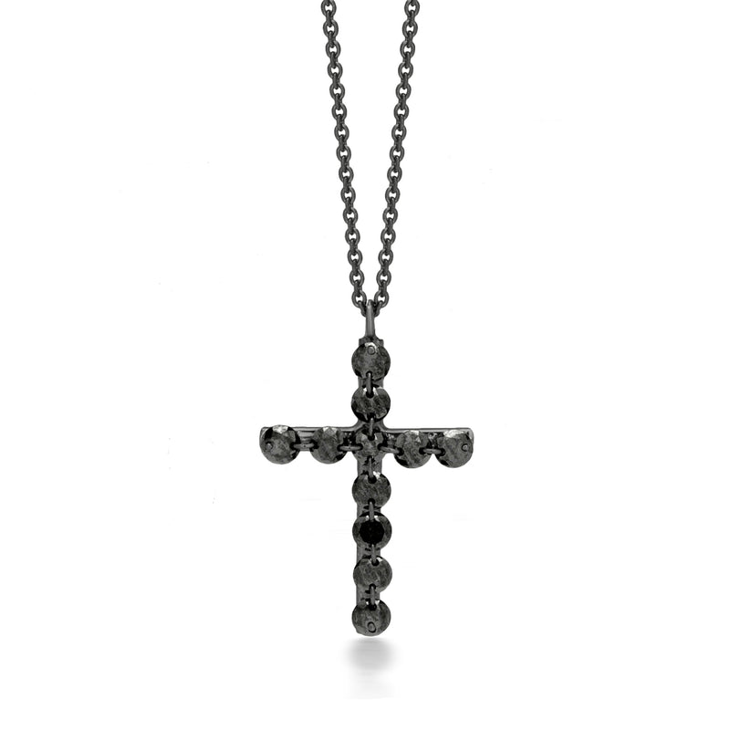 Black diamond cross pendant necklace with dark stone detailing on a silver chain