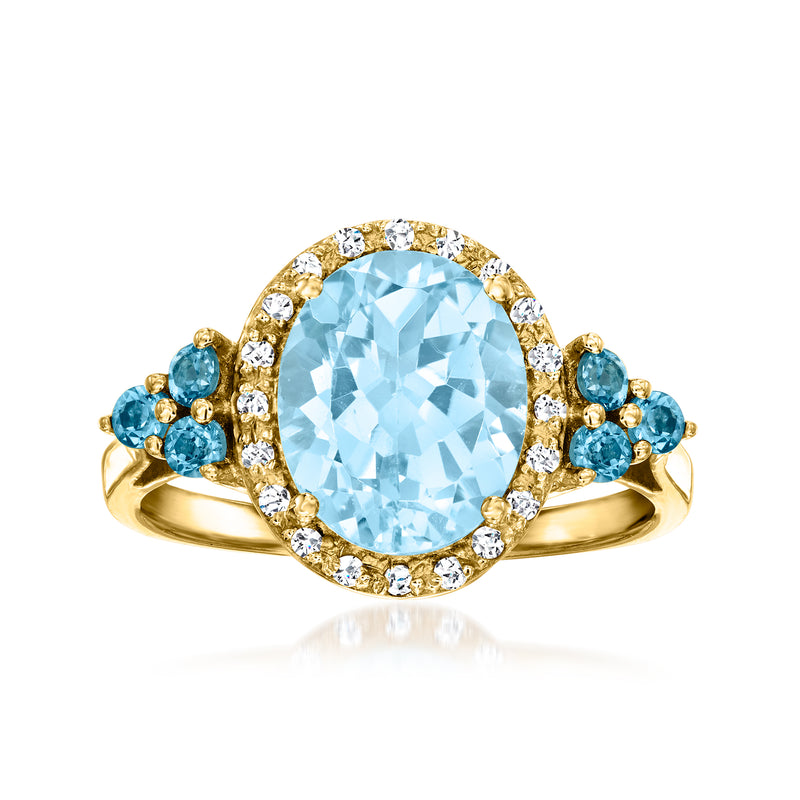 Oval sky-blue topaz ring with diamond halo, blue side stones, gold band