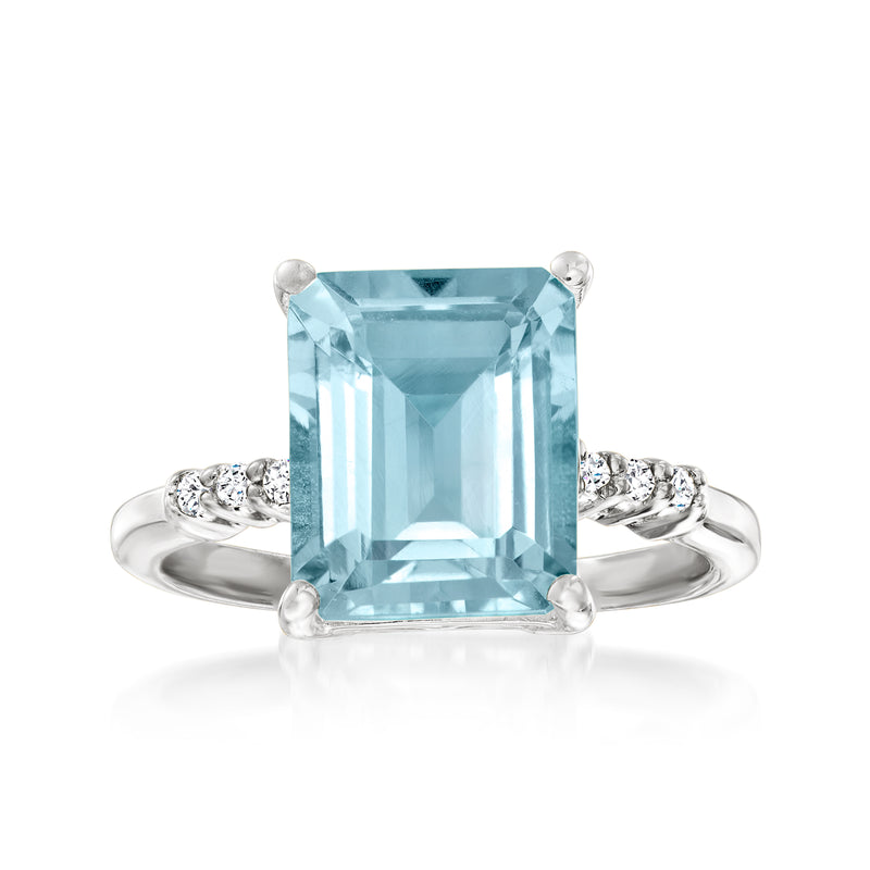 Sterling silver ring with large sky blue rectangular topaz and small white stones