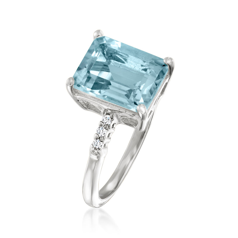 Sterling silver ring with tilted sky blue rectangular topaz and white side accents