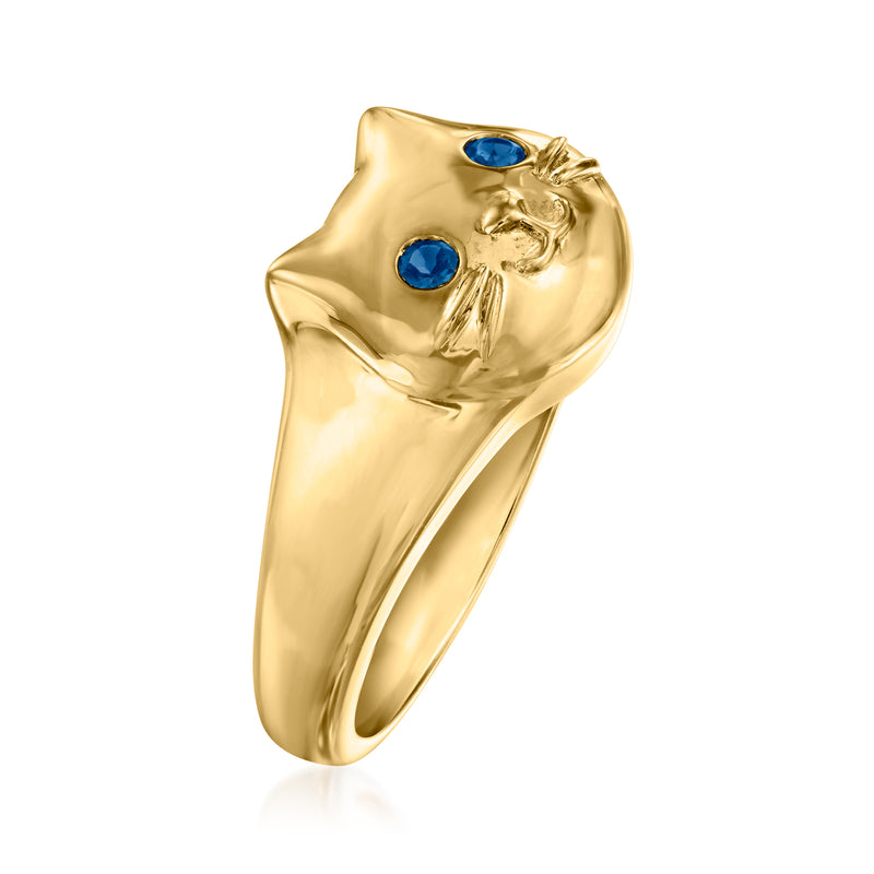 Gold cat ring side view with blue gemstone eyes and detailed whiskers