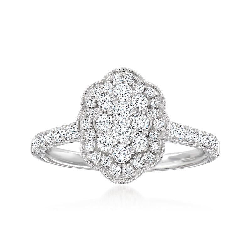 14kt white gold diamond flower cluster ring with round brilliant center and side stones