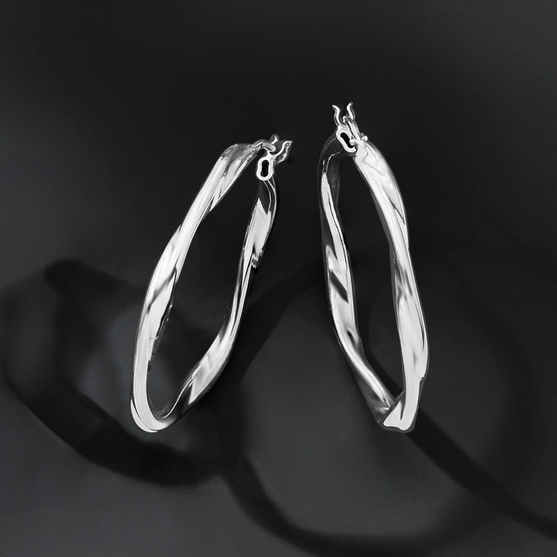 Sterling silver twisted hoop earrings, hinged clasp, angled side view