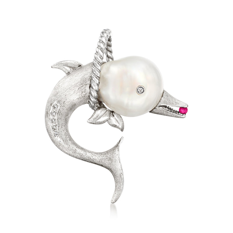 Dolphin pin with large white pearl, diamond detail and small ruby accents in silver tone