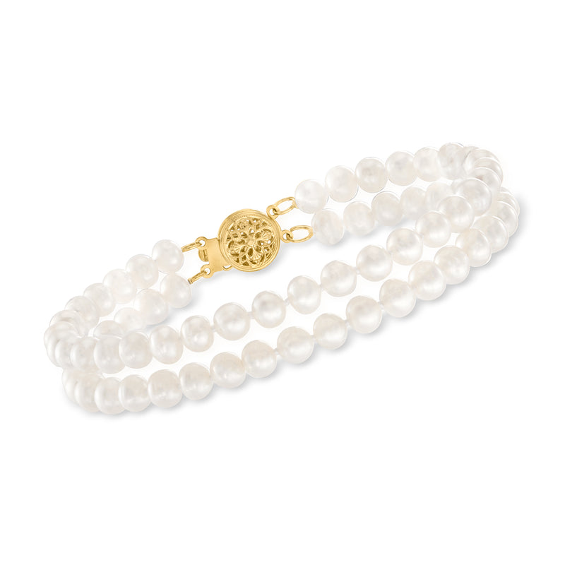 Two-row white cultured pearl bracelet with 14kt yellow gold clasp and round medallion