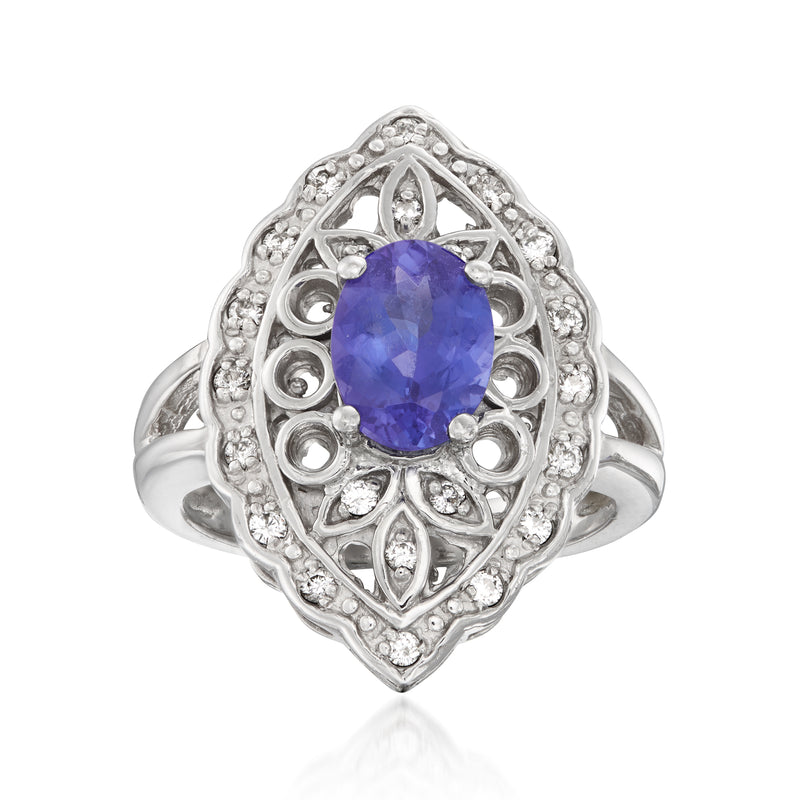 Vintage 14kt white gold ring with oval blue tanzanite center and diamond halo