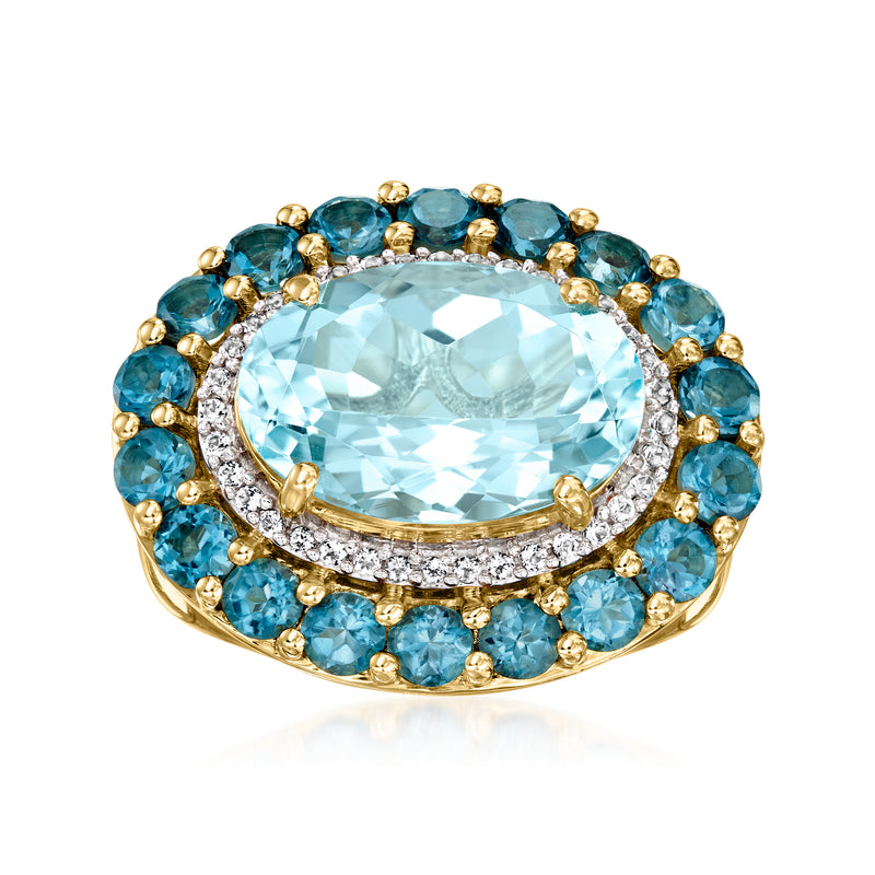 Oval blue topaz ring with gold halo of blue stones and clear diamonds accents