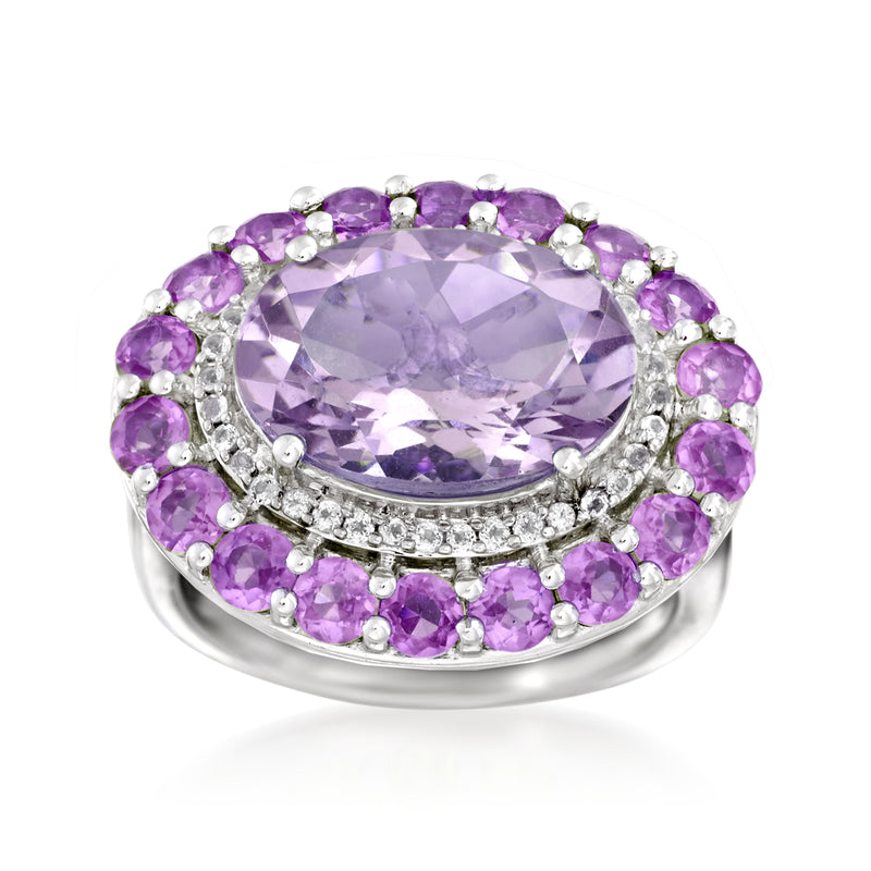 Sterling silver cocktail ring with oval amethyst center and round purple halo stones