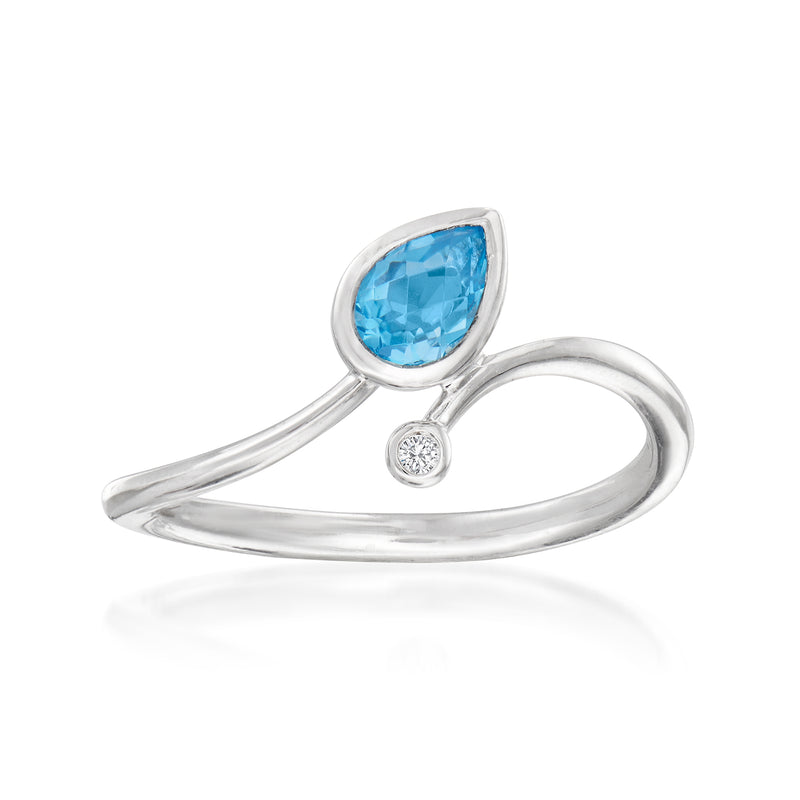 Sterling silver bypass ring with oval blue topaz and small round diamond