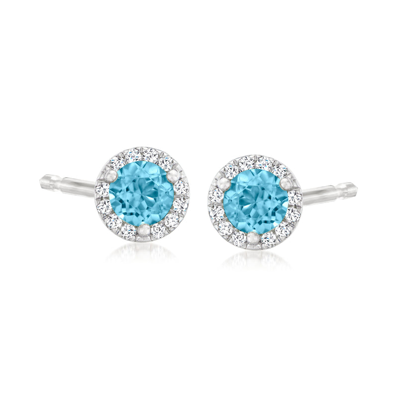 14kt white gold halo stud earrings with blue topaz center and diamond surround, post backs