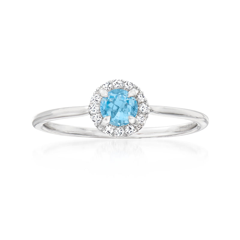 14kt white gold ring with Swiss blue topaz center and diamond halo
