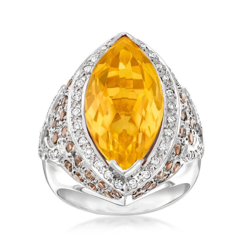 White gold ring with oval yellow citrine center, diamond halo, and filigree sides