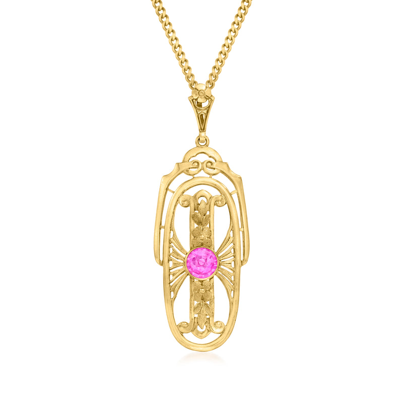 Yellow gold ruby pendant necklace with oval cage setting and pink gemstone