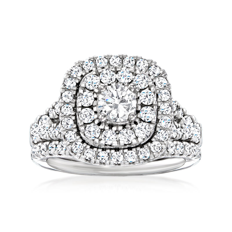 Diamond bridal set ring in 14kt white gold with round center and halo
