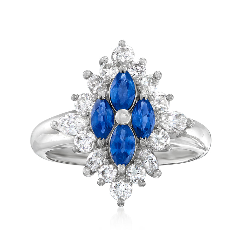 Platinum vintage ring with oval blue sapphire center and surrounding diamonds