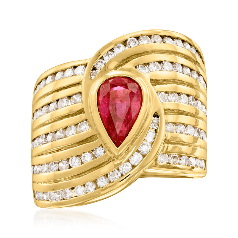 Yellow gold ruby and diamond cocktail ring with teardrop red center stone