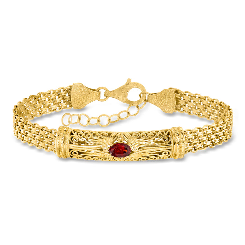 Gold over sterling filigree bracelet with red garnet center and mesh chain links