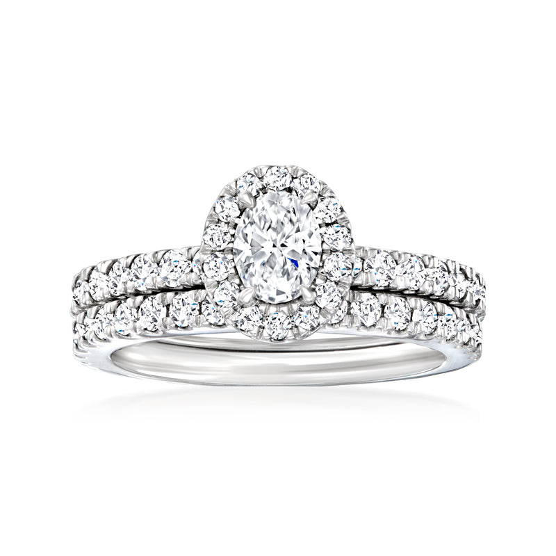 Diamond bridal set with oval halo engagement ring and matching white gold band