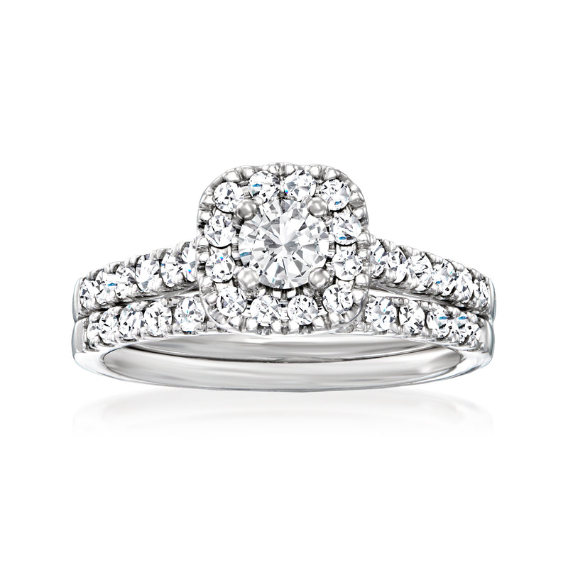 Diamond bridal set with round center stone and pavé 14kt white gold bands