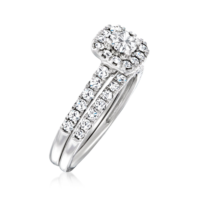 Diamond bridal set in 14kt white gold with halo engagement ring and matching band