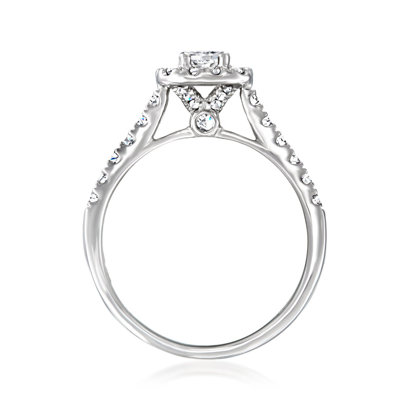 Diamond bridal set ring in white gold with round center stone and pavé shoulders