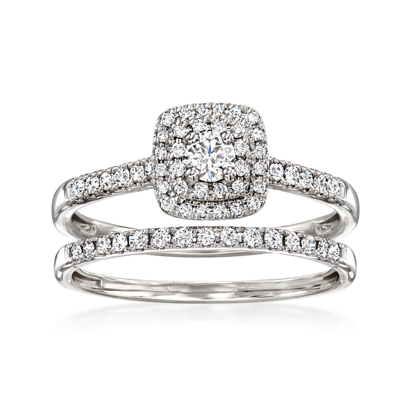 Diamond bridal set with halo engagement ring and matching band in white gold