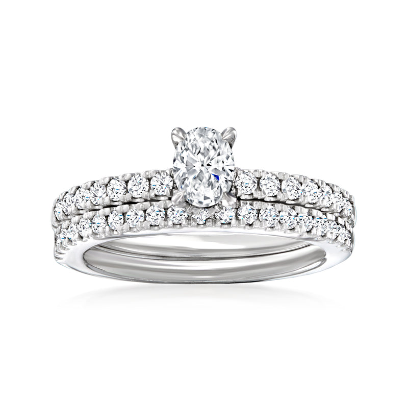 14k white gold diamond bridal set with round center stone and pave row band