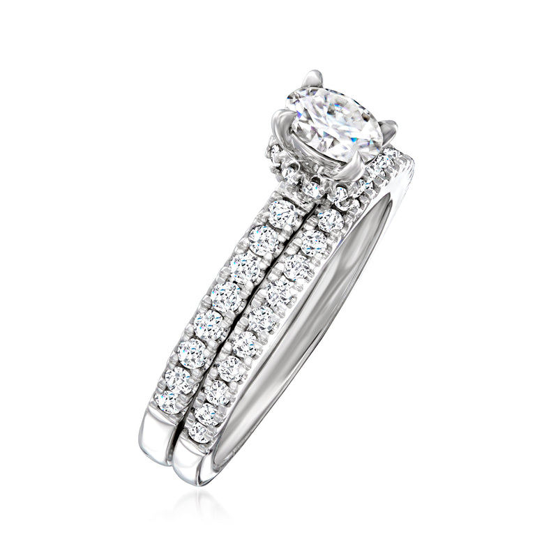 14k white gold diamond bridal set featuring round center stone and multi-row pave