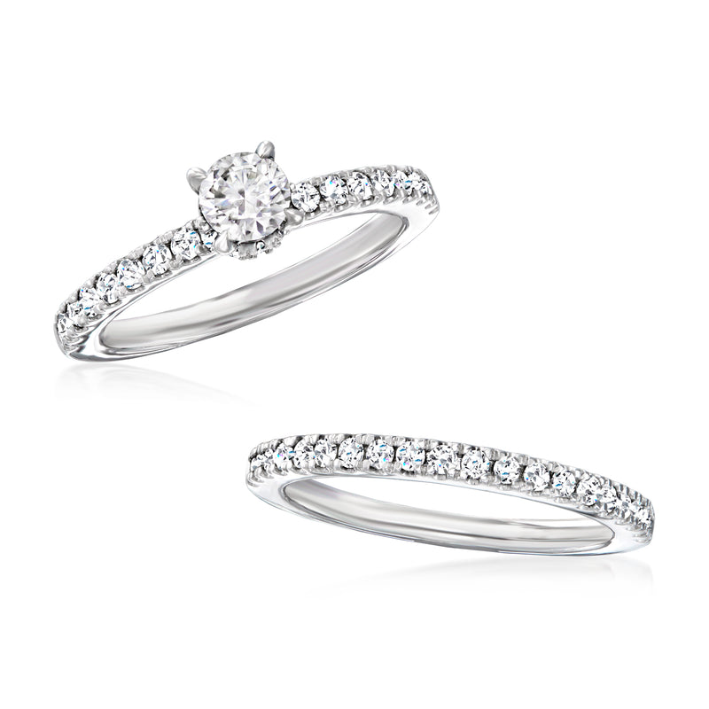 Diamond bridal set in 14kt white gold, with round center stone and pavé bands