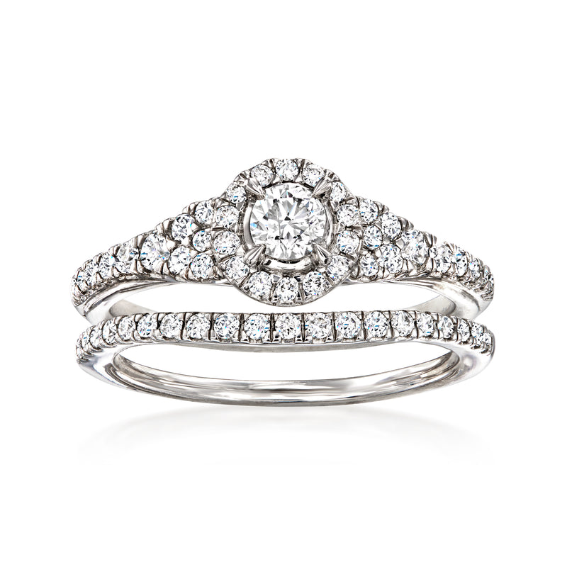 Diamond bridal set with round halo engagement ring and pavé wedding band