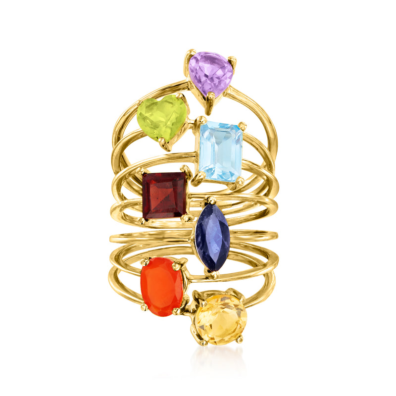 Gold-tone multi-gemstone ring stack with seven stones: purple, green, blue, red, yellow