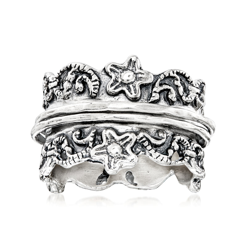 Sterling silver spinner ring with sea life engravings and raised shell details
