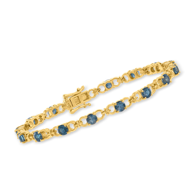 18kt gold over sterling tennis bracelet with blue topaz stones in gold settings