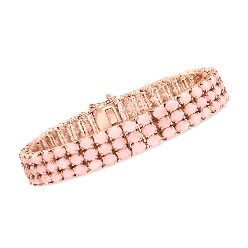 Three-row pink opal tennis bracelet in rose-gold tone, round bezel-set stones.