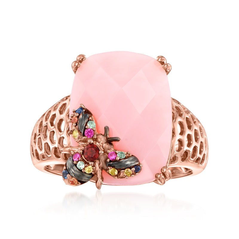Rose gold-tone ring with large pink oval gemstone and multicolor bee cluster details