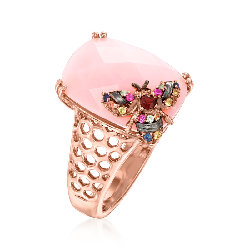 Rose gold-tone ring with pink oval gemstone, side view of multicolor bee motif