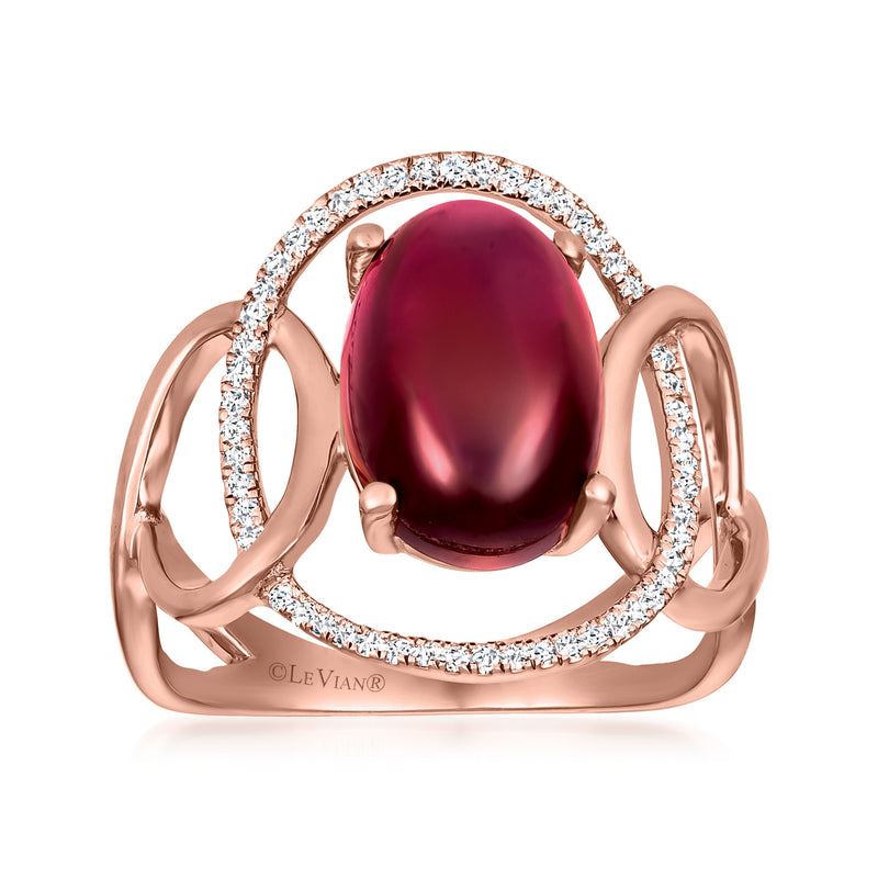 Rose gold ring with oval raspberry rhodolite center and halo of round white diamonds