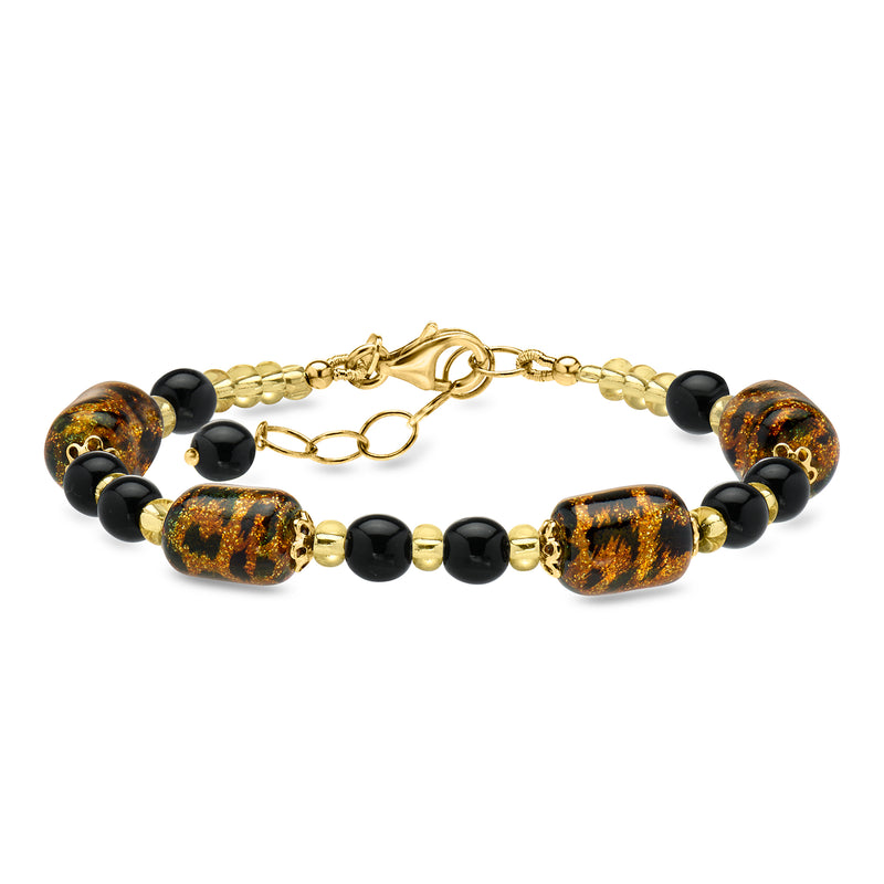 Gold-tone chain bracelet with black beads and amber speckled glass oval centers