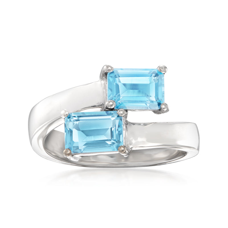 Sterling silver bypass ring with two sky-blue topaz emerald-cut stones