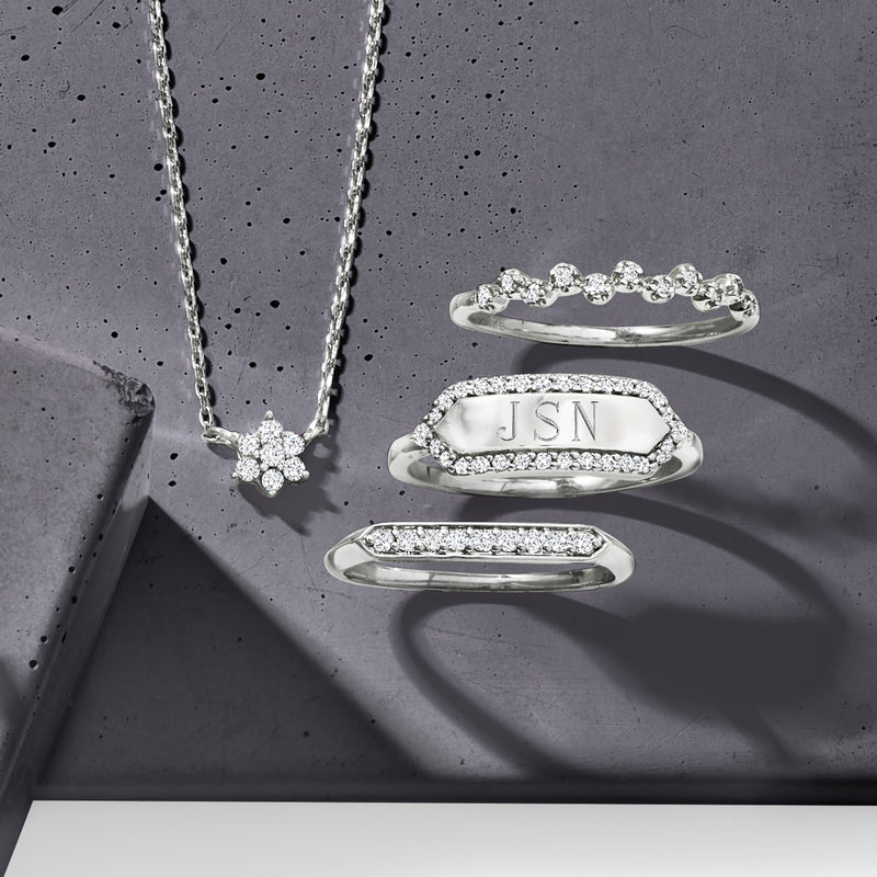 Sterling silver diamond ring with oval top engraved JSN, plus matching stack rings