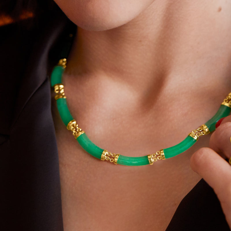Green jade bead choker with gold-toned links and clasp detail, close-up